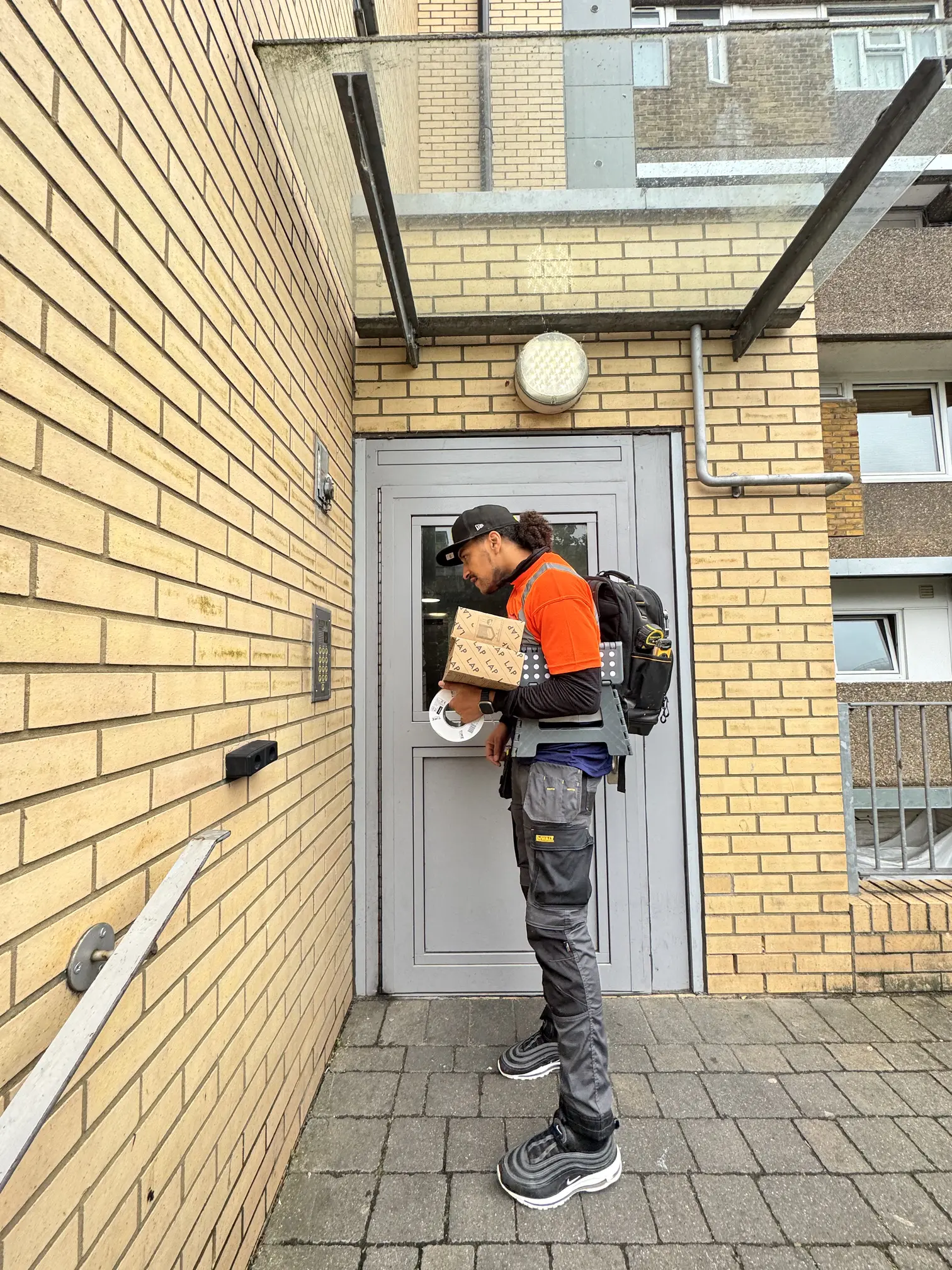 Community Heroes volunteer arriving at a property with tools